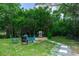 Backyard retreat with outdoor seating area and stainless steel grill for entertaining at 1820 N Merrick Dr, Deltona, FL 32738