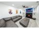 Entertainment room features comfortable seating, fireplace, and wall-mounted TV at 1820 N Merrick Dr, Deltona, FL 32738