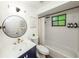 Bright bathroom with sleek fixtures, tub-shower combo, and a stylish navy vanity at 1820 N Merrick Dr, Deltona, FL 32738