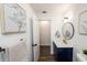 Nicely-appointed bathroom with sleek fixtures, new lighting, and a stylish vanity at 1820 N Merrick Dr, Deltona, FL 32738