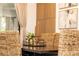 Close-up of dining table with natural chairs, candles, and modern wall accents at 1820 N Merrick Dr, Deltona, FL 32738