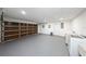 Spacious garage with laundry hookups and wood look doors at 1820 N Merrick Dr, Deltona, FL 32738
