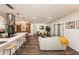 Bright, open-concept living room featuring wood floors and an open flow to kitchen and dining areas at 1820 N Merrick Dr, Deltona, FL 32738