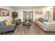Sun-filled living room with hardwood floors and elegant decor, perfect for relaxation at 1820 N Merrick Dr, Deltona, FL 32738
