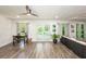 Bright living room featuring wood floors, neutral walls, and a comfortable seating area at 1820 N Merrick Dr, Deltona, FL 32738