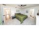Comfortable bedroom featuring plush carpet, an ensuite bath, and ample closet space at 1820 N Merrick Dr, Deltona, FL 32738