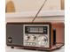 Close up of a retro-style radio with wood finish and tuning dial at 1820 N Merrick Dr, Deltona, FL 32738