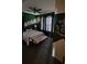 Cozy bedroom with a Slytherin theme, creative wall decor, and a ceiling fan at 153 Tigerlily Ct, Davenport, FL 33837
