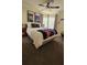 Star Wars-themed bedroom with ceiling fan, movie posters, and large comfy bed at 153 Tigerlily Ct, Davenport, FL 33837