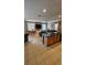 Open-concept living and dining area boasts tile flooring, large windows, and ample natural light at 153 Tigerlily Ct, Davenport, FL 33837