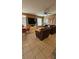 Inviting living room with large windows, tiled floors, comfortable seating and modern decor at 153 Tigerlily Ct, Davenport, FL 33837
