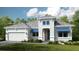 Inviting two-story home with a manicured lawn, two car garage and charming architectural details at 5653 Nevis Ter, Kissimmee, FL 34758