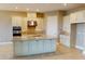 Spacious kitchen with a central island, stainless steel appliances, and plenty of cabinet space at 5653 Nevis Ter, Kissimmee, FL 34758