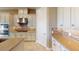 Well-equipped kitchen boasts stainless steel appliances, mosaic backsplash, and ample cabinet space at 5653 Nevis Ter, Kissimmee, FL 34758