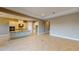 Open-concept living space with modern finishes, tile flooring, and a stylish kitchen island at 5653 Nevis Ter, Kissimmee, FL 34758