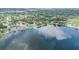 Aerial view of lakefront properties with docks, mature trees, and bodies of water at 110 E Lauren Ct, Fern Park, FL 32730