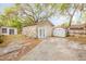 Backyard featuring stone building, shed, and partial fencing around the property at 110 E Lauren Ct, Fern Park, FL 32730
