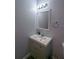 Bathroom vanity showcasing a stylish mirror, modern lighting, and a sink at 110 E Lauren Ct, Fern Park, FL 32730