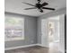 Bedroom showcases a ceiling fan and a window with plenty of natural light at 110 E Lauren Ct, Fern Park, FL 32730