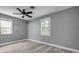 Bedroom featuring neutral walls, wood-style flooring, and two windows for natural light at 110 E Lauren Ct, Fern Park, FL 32730