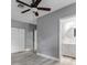 Bedroom featuring neutral walls, wood-style floors, ceiling fan, and ample closet space with access to a bathroom at 110 E Lauren Ct, Fern Park, FL 32730