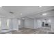 Open-concept living space with stylish flooring, recessed lighting and neutral gray walls at 110 E Lauren Ct, Fern Park, FL 32730