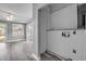 Open-concept living room with ceiling fan, sliding glass doors, and utility closet at 110 E Lauren Ct, Fern Park, FL 32730