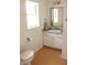 Bathroom with granite vanity, window and neutral colors at 20732 Sw Marine Blvd, Dunnellon, FL 34431