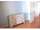 Bedroom with a white dresser and blue painted walls at 20732 Sw Marine Blvd, Dunnellon, FL 34431