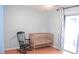 Bedroom featuring a crib, rocking chair and natural lighting at 20732 Sw Marine Blvd, Dunnellon, FL 34431