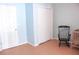 Bedroom featuring a crib, rocking chair, closet and door at 20732 Sw Marine Blvd, Dunnellon, FL 34431