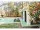 Exterior elevation view of a home featuring arched windows, decorative sconces and tropical landscaping at 20732 Sw Marine Blvd, Dunnellon, FL 34431