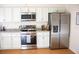 Bright kitchen with stainless steel appliances, white cabinets, and granite countertops at 20732 Sw Marine Blvd, Dunnellon, FL 34431