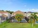 Aerial view of backyard with screened-in pool, mature landscaping and fenced in yard at 460 Tess Ct, Orlando, FL 32834