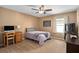 Bedroom with beige walls, carpet, and a ceiling fan at 460 Tess Ct, Orlando, FL 32834