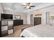 Comfortable main bedroom featuring an ensuite bathroom, a trey ceiling, and ample closet space at 460 Tess Ct, Orlando, FL 32834