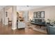 Bright and inviting living room featuring wood-look floors, stylish furniture, and ample natural light at 460 Tess Ct, Orlando, FL 32834