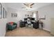 Home office with neutral walls, a ceiling fan, carpet and dark furniture at 460 Tess Ct, Orlando, FL 32834