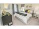 Comfortable bedroom with modern decor, plush bedding, and plenty of natural light at 5884 Meditation Dr, Clermont, FL 34714