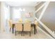 Dining area with stylish accent wall, chandelier, and seating for four at 5884 Meditation Dr, Clermont, FL 34714