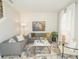 Bright living room featuring neutral furniture, decorative rug, and ample natural light at 5884 Meditation Dr, Clermont, FL 34714