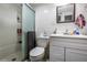 Clean bathroom with shower, modern fixtures, and ample storage space at 5932 Hilltop E Ln, Lakeland, FL 33809