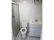 Bright bathroom featuring a glass enclosed shower, tile flooring and a modern vanity at 5932 Hilltop E Ln, Lakeland, FL 33809