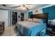 Comfortable bedroom with ample closet space, natural lighting, and modern decor at 5932 Hilltop E Ln, Lakeland, FL 33809