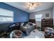 Well-lit bedroom with a comfortable beanbag, natural light, and neutral color scheme at 5932 Hilltop E Ln, Lakeland, FL 33809