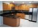 Updated kitchen with stainless steel appliances, and wood cabinets at 5932 Hilltop E Ln, Lakeland, FL 33809