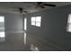 Spacious living room with ceiling fans and windows at 5932 Hilltop E Ln, Lakeland, FL 33809