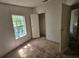 Empty bedroom featuring bright window light and closet space at 6736 Cr 772, Webster, FL 33597