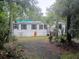 Single-story home nestled among trees in a serene, natural setting at 6736 Cr 772, Webster, FL 33597