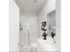 Clean and modern bathroom with a walk-in shower and sleek vanity at 7656 Gemstone St, Groveland, FL 34736